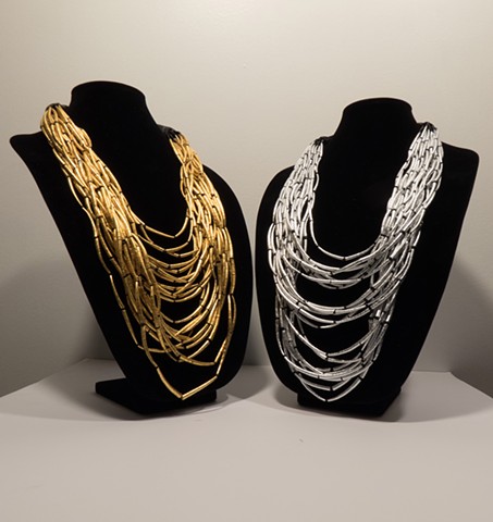 dentalium shell necklaces covered in gold leaf and silver leaf. Hupa