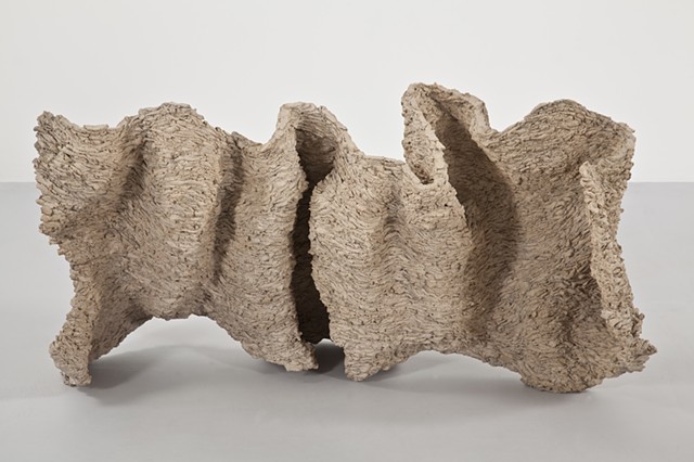 Clay sculpture by artist Paul March entitled Extended Phenotype 2, resembling organic wall