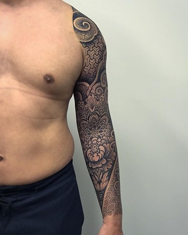 Japanese and geometric mixed patterns done by Alvaro Flores Tattooer at La Flor Sagrada Tattoo in Melbourne Australia