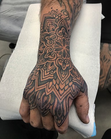 Ornamental thai style hand tattoo by Alvaro Flores Tattooer from La Flor Sagrada Tattoo in Melbourne Australia 