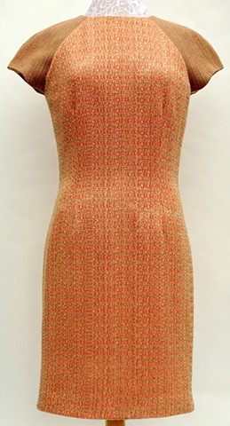 Handwoven dress in two variations of turned Beiderwand threading. Garment design and construction by Susan Stowell.
