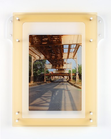 Digital pigment print on transparency film with laser-cut acrylic of urban setting by Yvette Kaiser Smith