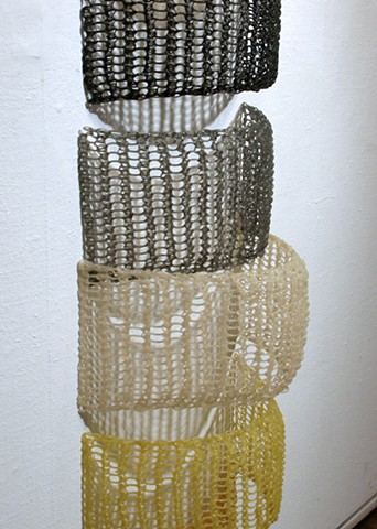Crocheted fiberglass and polyester resin grid wall sculpture based on the number e  by Yvette Kaiser Smith
