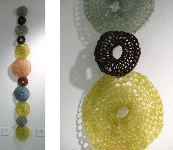 Minimal geometric crocheted fiberglass and polyester resin wall sculpture based on the number pi by Yvette Kaiser Smith