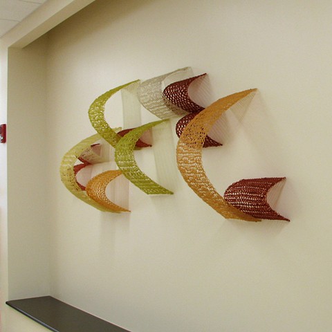 Geometric crocheted fiberglass and polyester resin wall sculpture based on Pi by Yvette Kaiser Smith