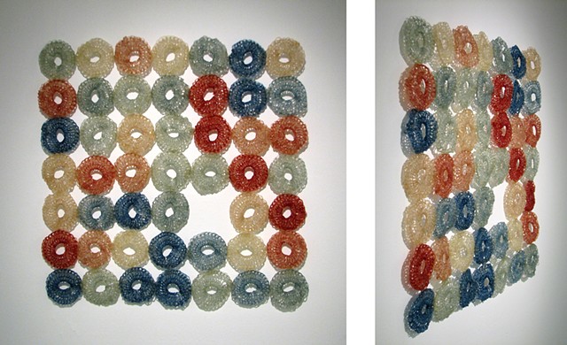 Minimal geometric crocheted fiberglass and polyester resin wall sculpture grid based on pi by Yvette Kaiser Smith