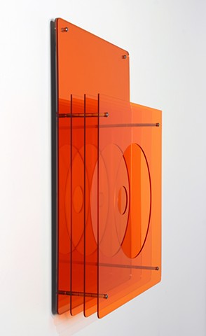 Geometric abstraction, based on number sequence, in mirrored and orange laser-cut acrylic based on e by Yvette Kaiser Smith