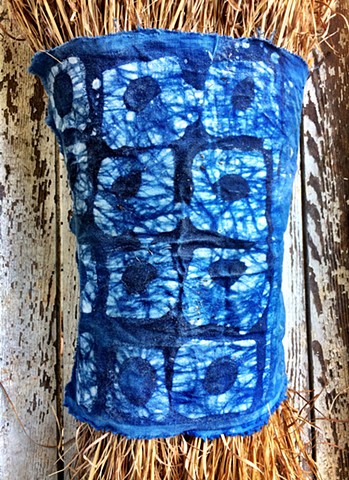 Indigo dye and batik on cotton wrapping a Sedge Broom bundle.