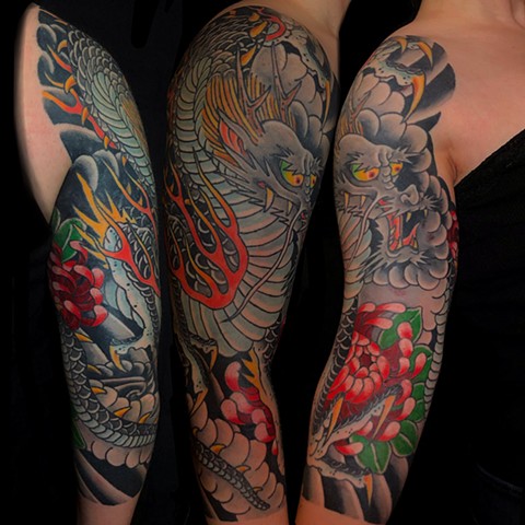 3/4 Dragon sleeve with flowers by Fran Massino at stay humble tattoo company in baltimore maryland the best tattoo shop and artist in baltimore maryland specializing in Japanese tattoo