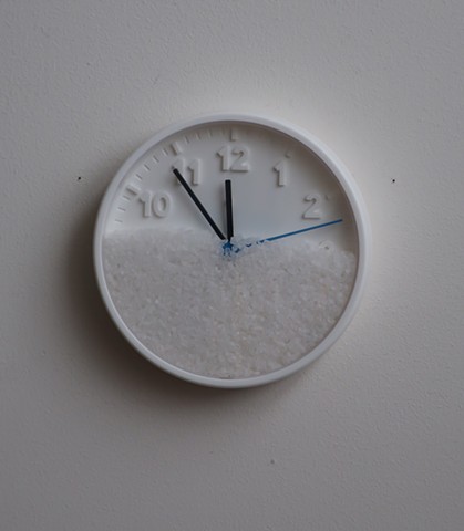Robert Fields, "Moments and the passing of moments--this is life." Ps 3:1-9. 2019. Wall clock (plastic, battery not included) & salt. 8" Dia. x 1-1/2" Depth.