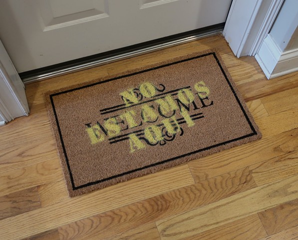 Robert Fields, "NOT HERE!" ...(Enough's enough.) 2019. 18" H x 30 " W. Acrylic aerosol on “WELCOME” coco door mat. This is nuts! We are, one and all, immigrants. 
