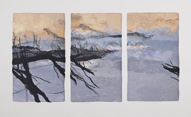 handmade felt wall piece made of dyed, unspun wool and yarns, by Sharron Parker.  A somewhat abstract landscape of trees, water, and  mountains.