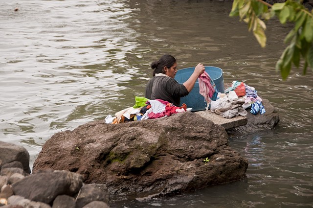 Washing clothes in the river.