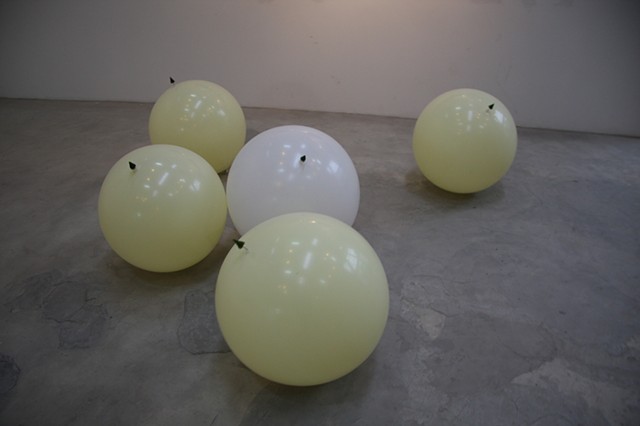 balloons with attached trees, drifting on the floor