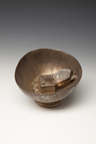 porcelain cup with bronze glaze