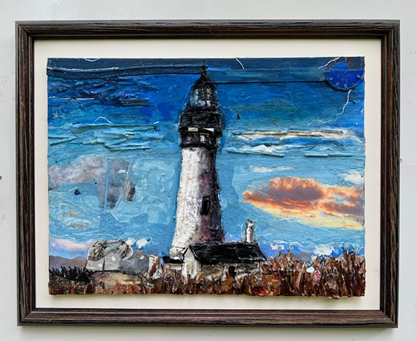 Found object collage painting of a lighthouse in Yaquina Bay, Oregon with lots of deep blue color along with black and white and brown