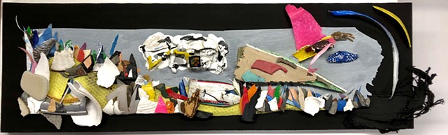 This mixed media seascape by Steven Tannenbaum uses found obejcts and trash to create a scene with waves, a boat, and a bird.