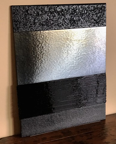 Textured glass portrays the night.