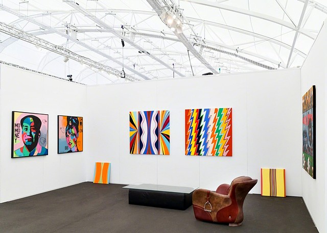 2018 Auckland Art Fair, Auckland, New Zealand represented by 12 Gallery.  Center Wall ( "Maybelle" and "Pollenator").  Both works 48 x 48", acrylic on canvas.  Color Bombs. The work of Johnny Romeo is on the left. 