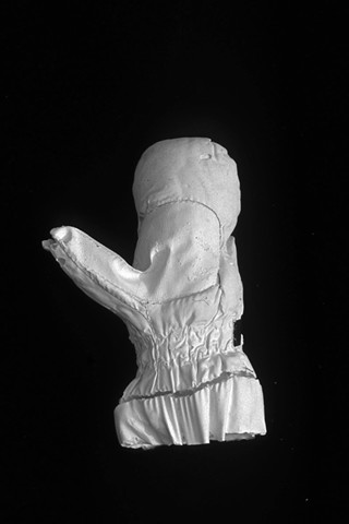 plaster casts of lost mittens, photographs, consumerism, mapping