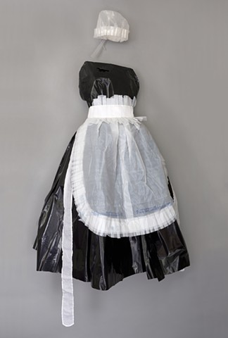 Mixed media maid's uniform sewn from Wal-Mart bags by Shara Rowley Plough.