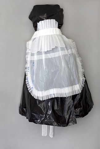 Mixed media maid's uniform sewn from Wal-Mart bags by Shara Rowley Plough.