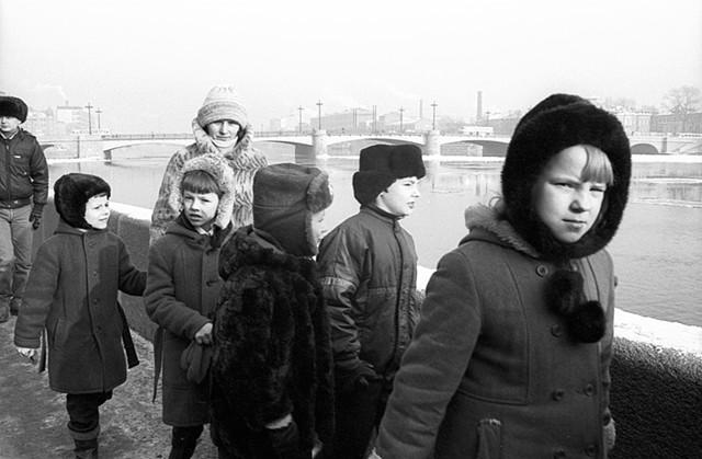 School children walking along the river Neva (stink eye)