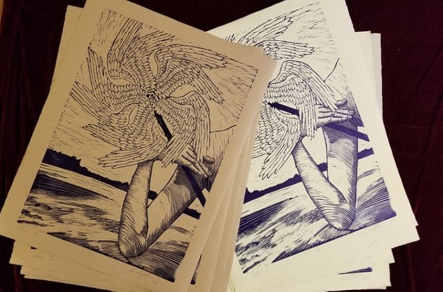 linocut with woman's art holding angel wing pinwheel again river landscape black & white print