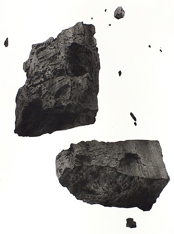 Drawing of realistic pieces of coal in white picture plane using charcoal done by Kathleen Thum