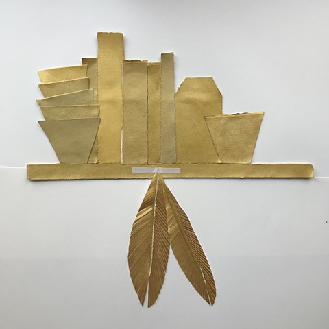 gold shelf with feathers