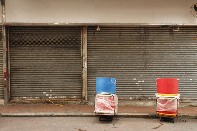 Formal compositional photography, street photography, walking, utilitarian spaces, bins, colour, city, cities, color, 