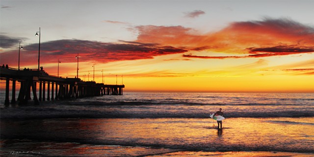 Venice Beach Ca.  surfing  sunset  at the Venice Ca. Pier