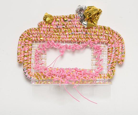 coiled sculpture in gold mylar emergency blankets, pink plastic lacing, plastic mesh, gold and silver leaf, and tangerine plastic beads by José Santiago Pérez