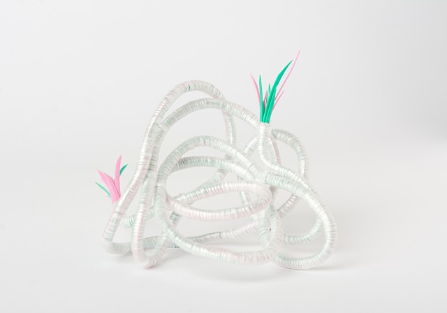 abstract plastic basket in pink and mint by Jose Santiago Perez