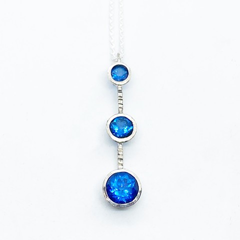 Ice blue topaz and sterling silver pendant on sterling silver chain