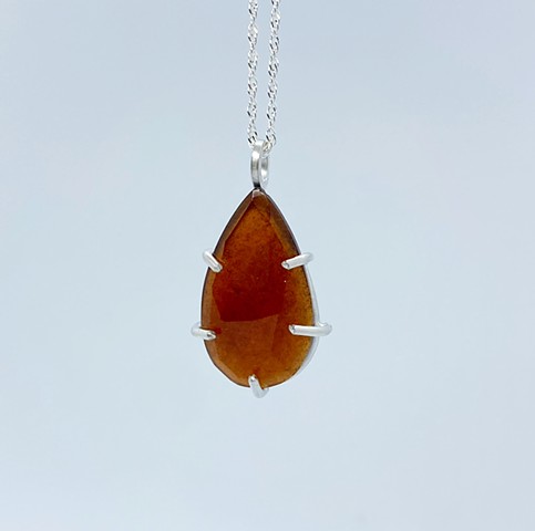 Prong set Hessonite garnet with sterling silver