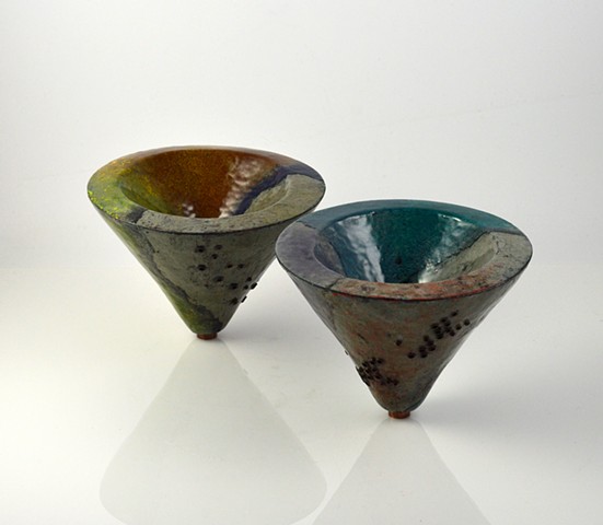 Set of two hollow constructed, enameled, copper vessles.