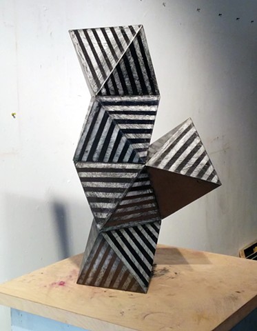 Geometric sculpture in monochromatic Graphite stripes
