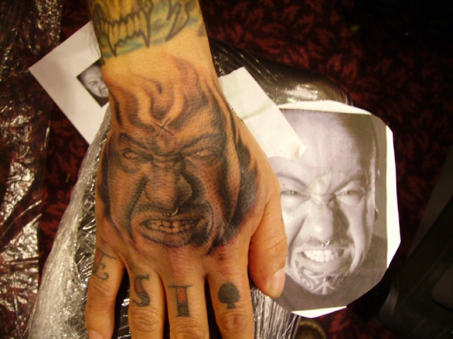 Ron Meyers - Evil Portrait of Tattoo Artist Manuel Vega on his hand. nothing like the pressure of tattooing a portrait on a "Portrait Artist"!!!
