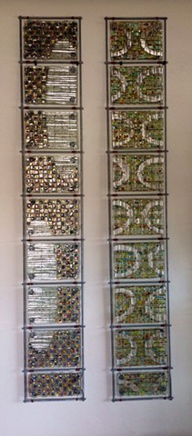 fused glass, mica, wire, and bead panels arranged in 8"x54" grids
