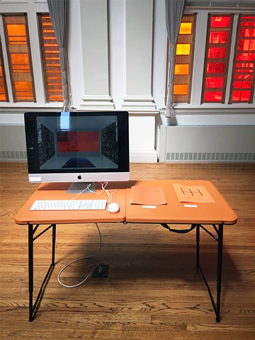 Installation view of computer with animations and zines
