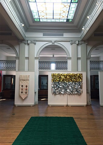 Installation view of Lies Above / Lies Hier with stained glass windows