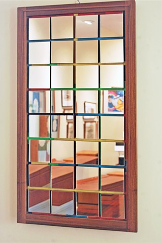 Confetti series mirror, the reflection showing deconstructed dining room.  Walnut frame 20 x 43".