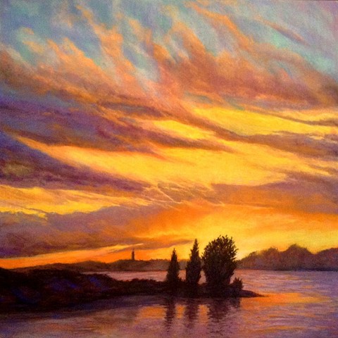 pastel landscape of a brilliant sunset over water
