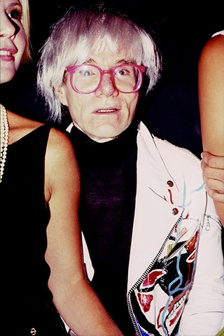 Andy Warhol at a party in 1985. 16in. x 20in. Chromogenic print.