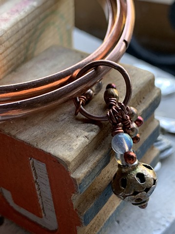 three copper bangles with labradorite,copper and brass beads