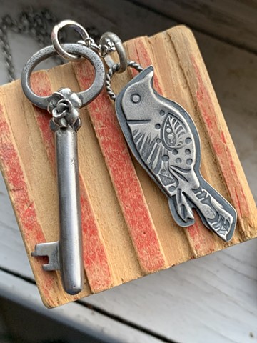 Sterling, hand stamped raven with authentic vintage key with sterling rose 65.00