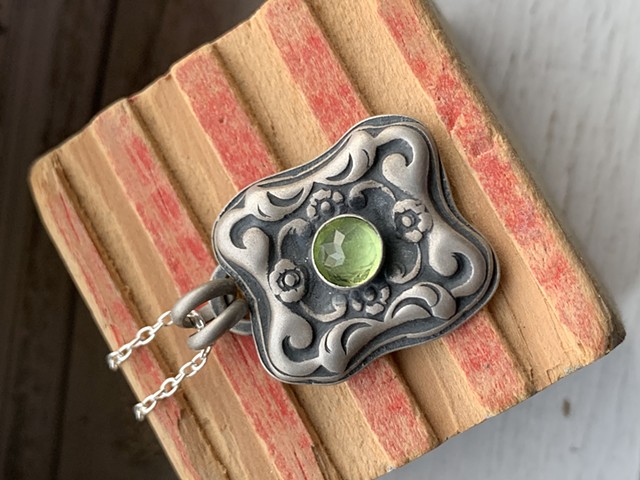 Sterling silver and peridot pendant on 18â€� sterling chain 65.00