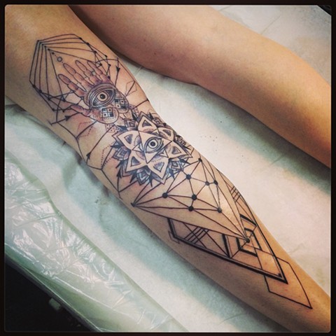 erin geometic leg tattoo