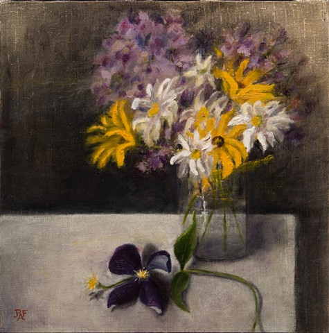 Clematis and flowers in glass vase